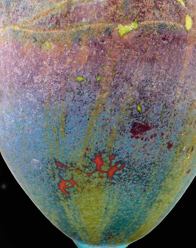 A close up of the surface of an old vase