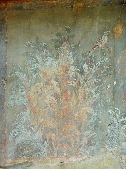 A painting of flowers on the wall
